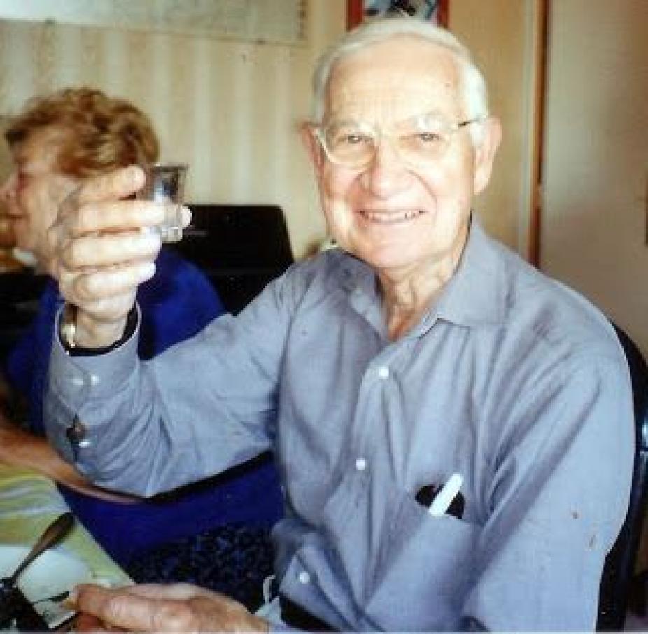 Andy Skumanich holding glass upright