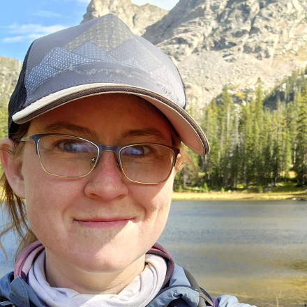 Elizabeth Bernhardt, headshot in outdoor mountain backdrop