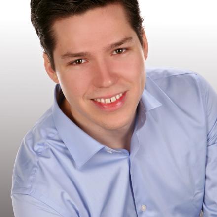 Robert Jarolim head portrait with blue button-down shirt