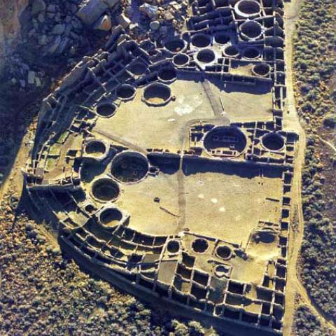 Aerial view of Pueblo Bonito at sunrise, with East to the top of the picture